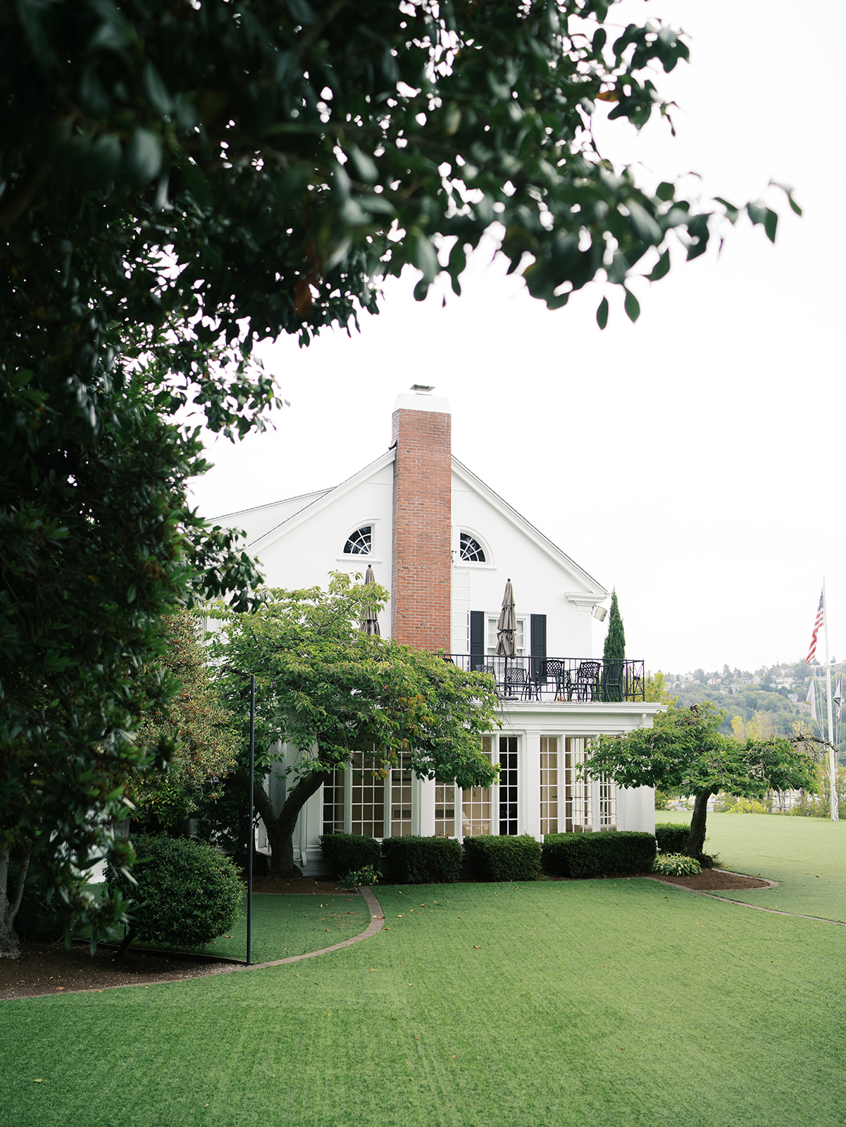 Elegant white exterior of The Admiral’s House in Seattle, photographed by a luxury wedding photographer.